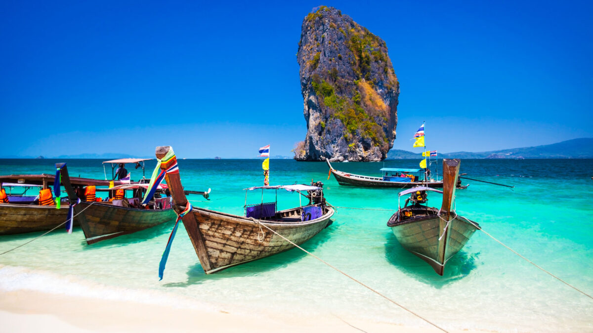 Boats in at beautiful beach on Andaman Sea in Thailand