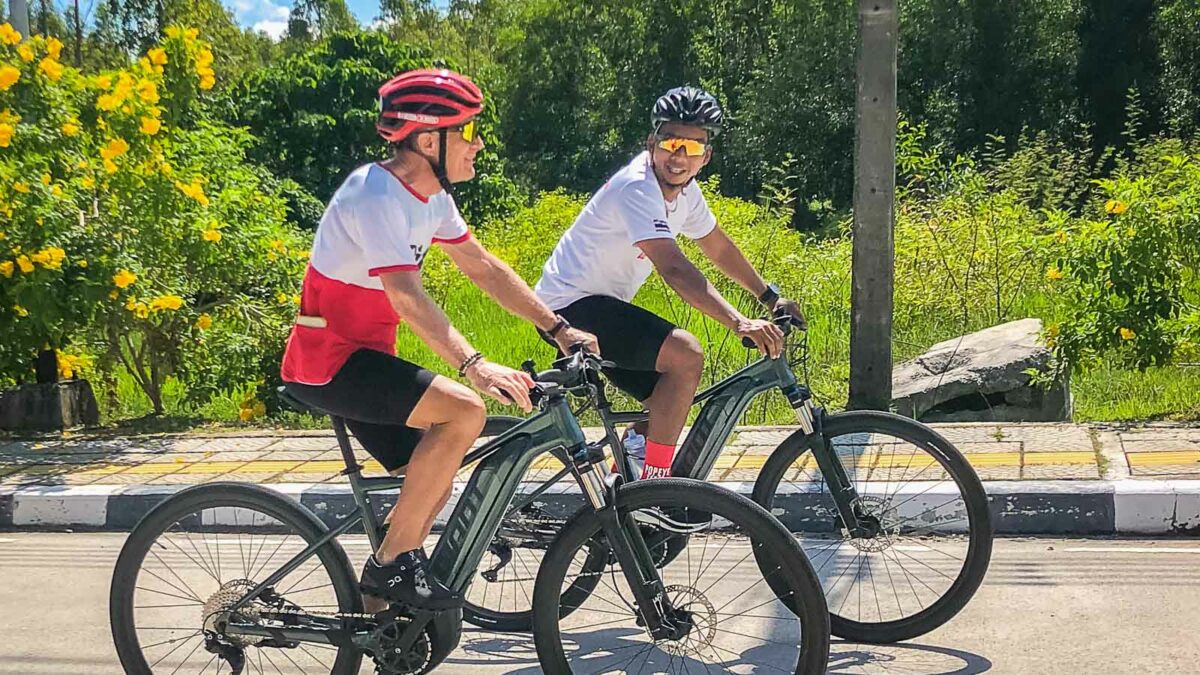 Two cyclists on e-bikes on phuket cycling tour
