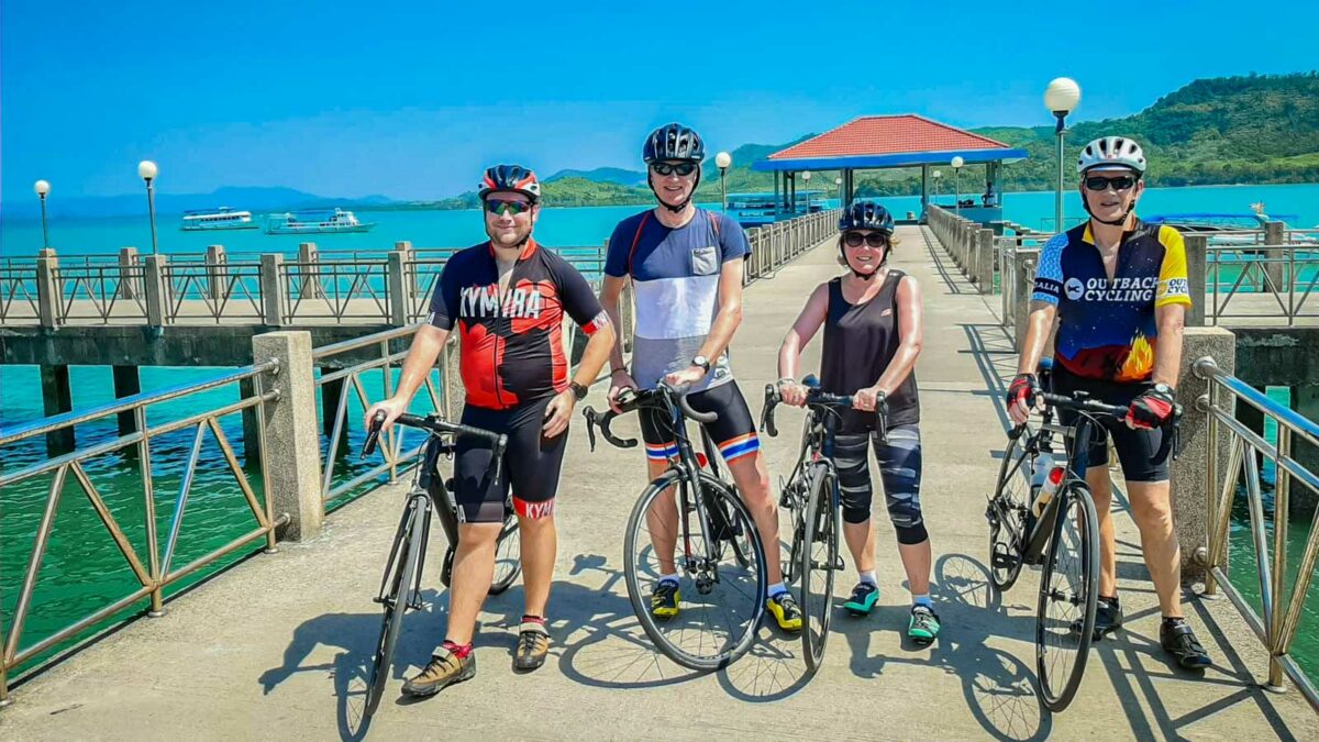 Cyclists on Laem Sai Pier in Thailand