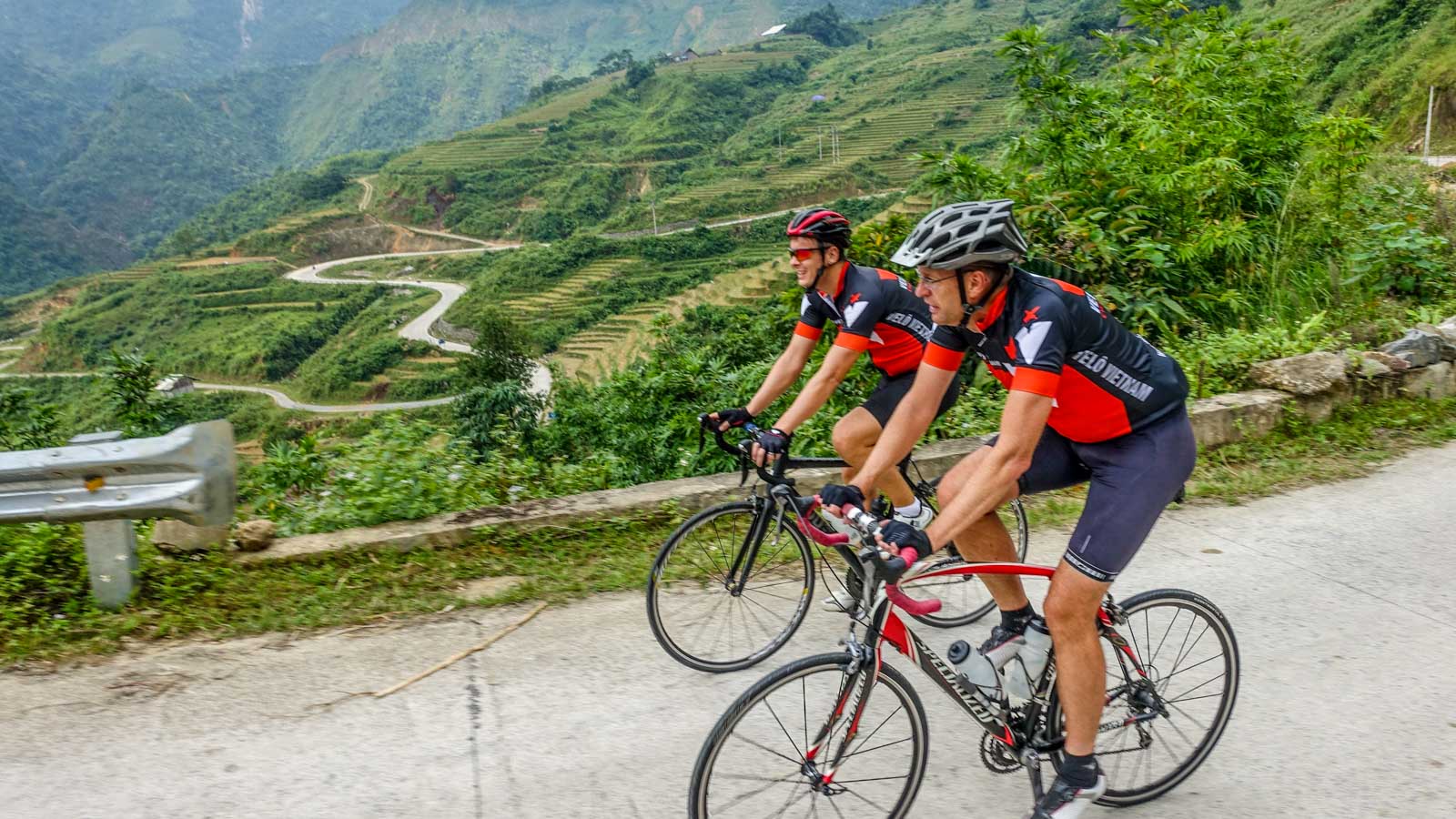 Cyclists riding through mountain pass in Vietnam